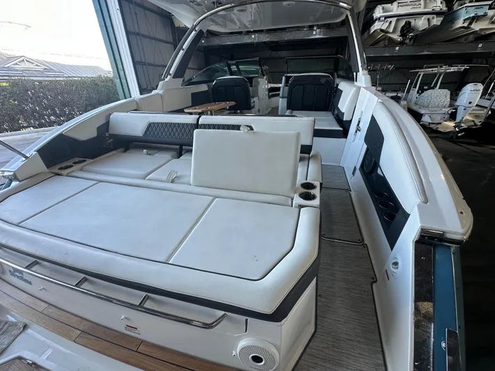  Yacht Photos Pics 2022 Cobalt R33 boat interior with spacious seating and modern design.