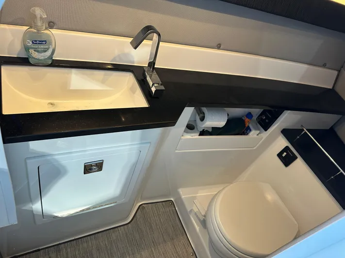  Yacht Photos Pics Modern Cobalt R33 2022 boat bathroom with sink, faucet, and toilet.