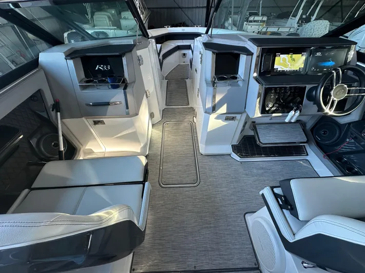  Yacht Photos Pics 2022 Cobalt R33 boat interior with modern dashboard and seating.