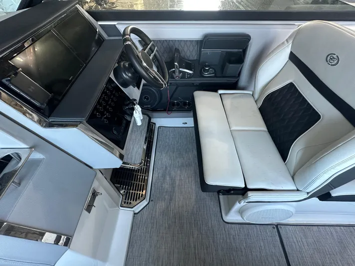 Yacht Photos Pics Interior of 2022 Cobalt R33 boat with modern steering and seating.