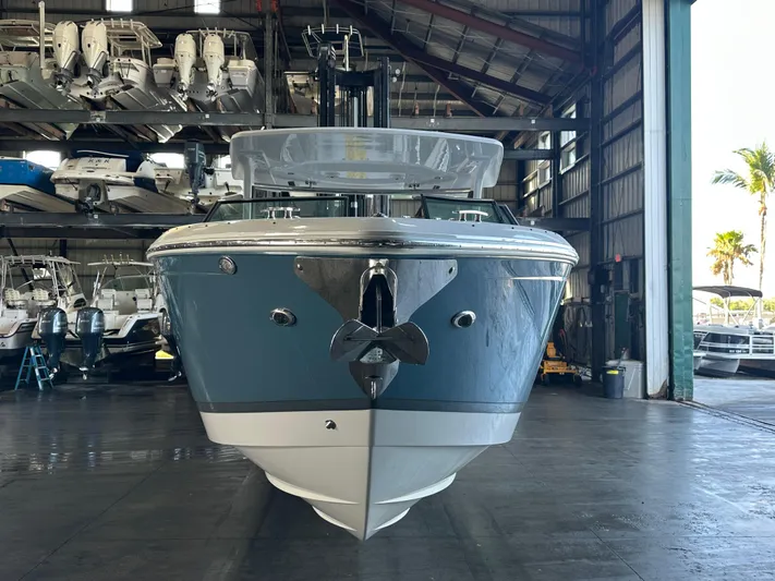  Yacht Photos Pics 2022 Cobalt R33 boat in a marina storage facility, front view.