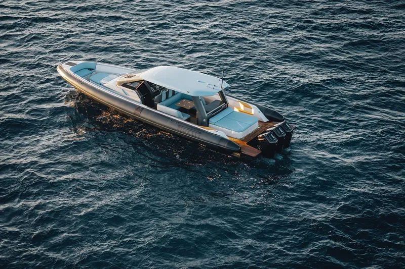  Yacht Photos Pics 2026 Pirelli 47 boat cruising on open water, showcasing sleek design and powerful engines.