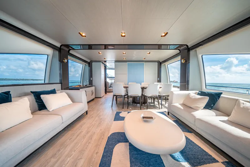 April Fools Yacht Photos Pics Luxurious interior of 2018 Azimut 80 Flybridge yacht with modern furnishings and ocean view.