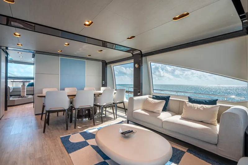 April Fools Yacht Photos Pics Luxurious interior of 2018 Azimut 80 Flybridge yacht with ocean view, modern furnishings.