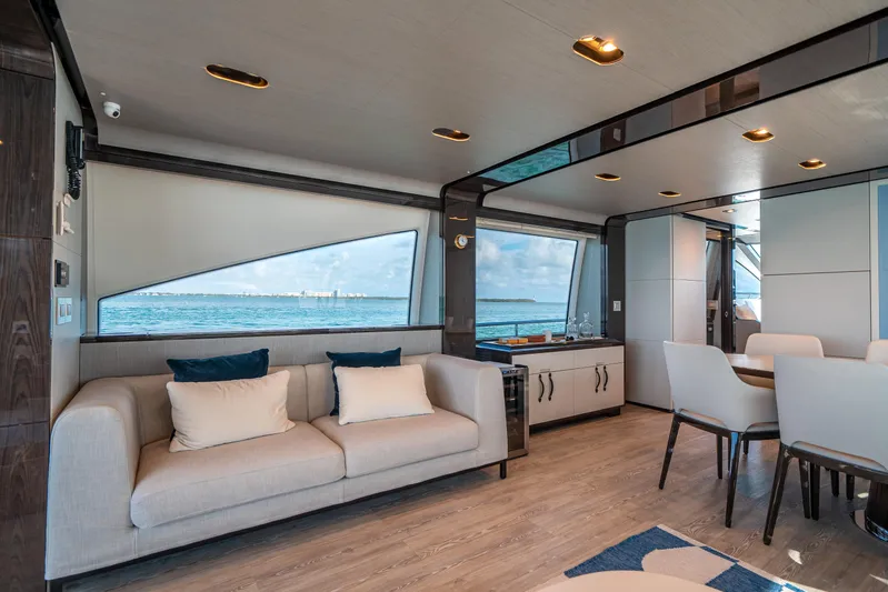 April Fools Yacht Photos Pics Luxurious interior of 2018 Azimut 80 Flybridge yacht with ocean view and modern furnishings.