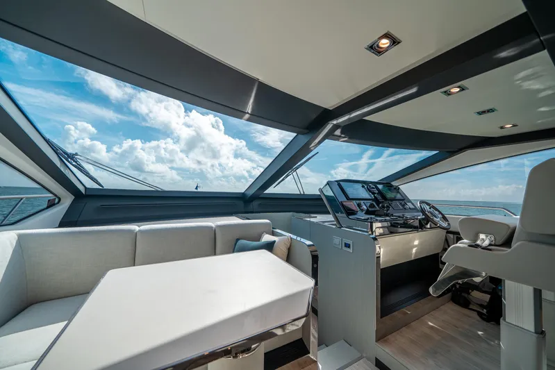 April Fools Yacht Photos Pics Luxurious interior of 2018 Azimut 80 Flybridge yacht with modern helm and seating.