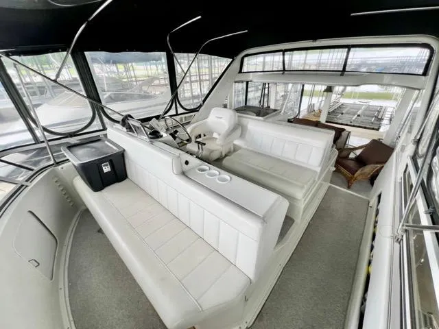 San Souci Yacht Photos Pics 1998 Carver 405 Motor Yacht interior with spacious seating and helm station.