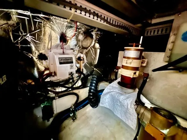 San Souci Yacht Photos Pics Engine room of 1998 Carver 405 Motor Yacht with mechanical components and wiring.