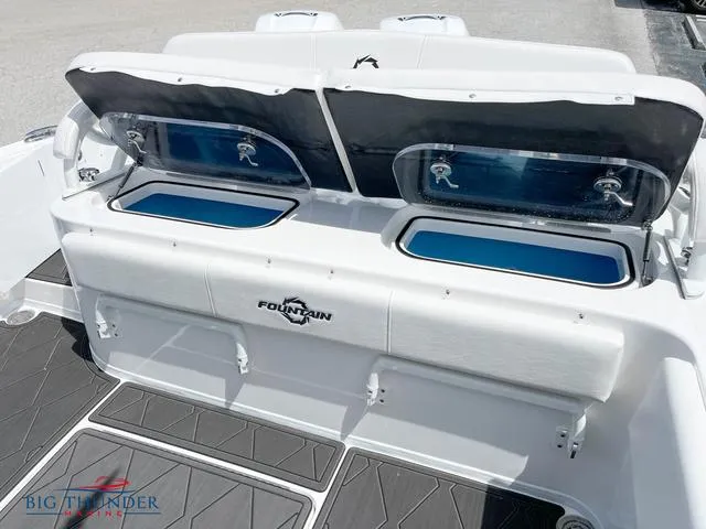  Yacht Photos Pics 2023 Fountain 34 TE boat with open storage compartments and seating.