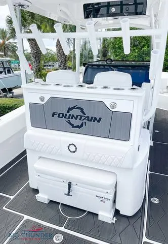  Yacht Photos Pics 2023 Fountain 34 TE boat interior with seating and storage.