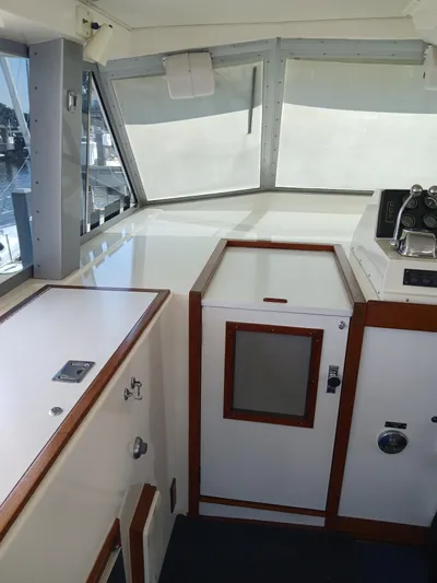  Yacht Photos Pics 1986 Bertram 46 Flybridge Motor Yacht interior with helm and navigation equipment.