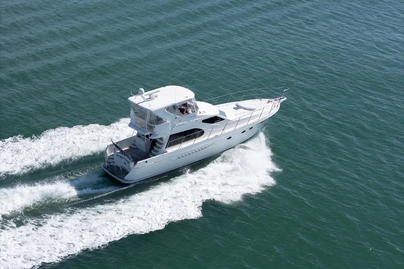 Port-folio Yacht Photos Pics 2007 Ocean Alexander 52 Sedan yacht cruising on open water.