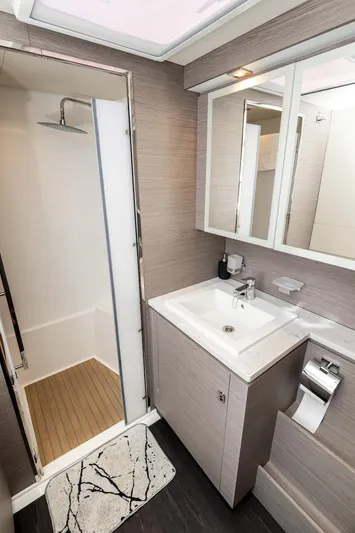  Yacht Photos Pics Modern bathroom in 2022 Fountaine Pajot MY6 yacht with shower and vanity.