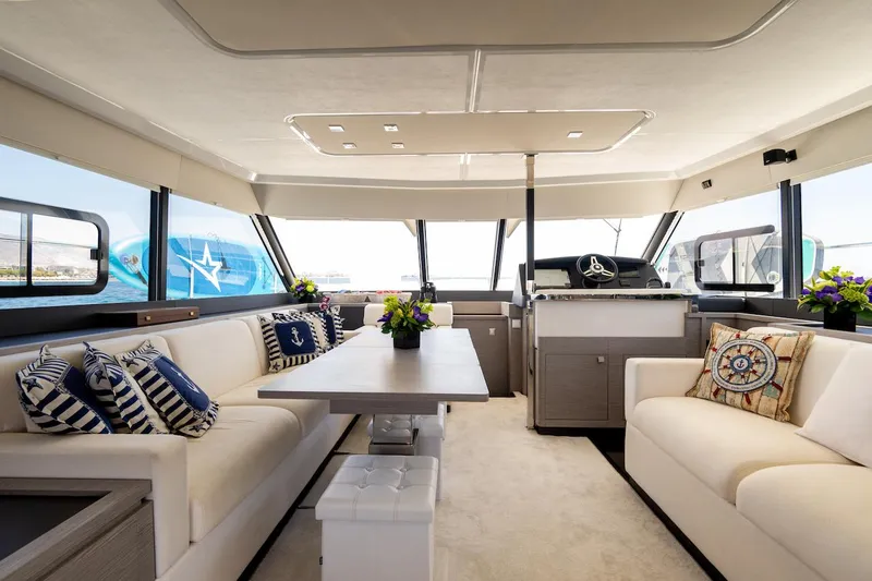  Yacht Photos Pics Luxurious interior of 2022 Fountaine Pajot MY6 yacht with elegant seating and nautical decor.