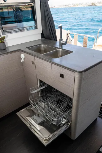  Yacht Photos Pics Modern kitchen on 2022 Fountaine Pajot MY6 yacht with dishwasher and dual sink.