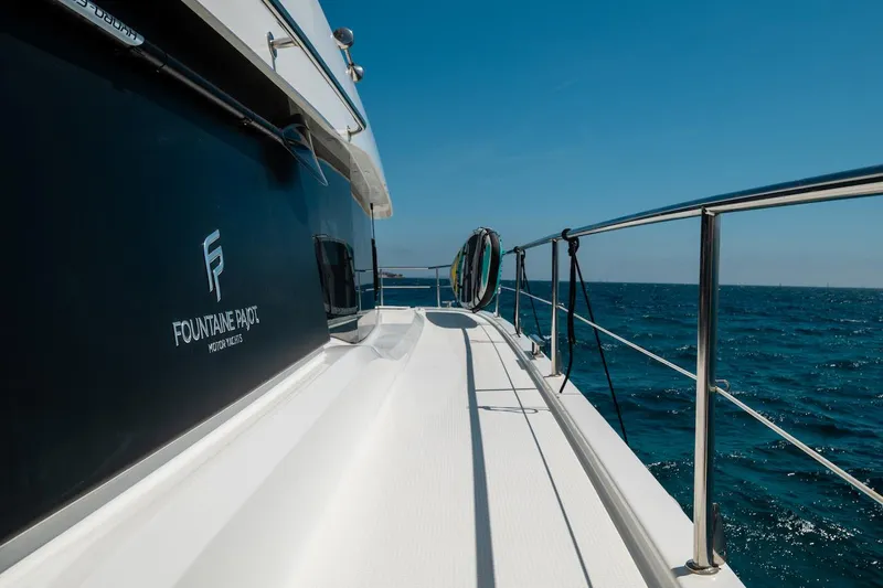  Yacht Photos Pics 2022 Fountaine Pajot MY6 yacht deck with ocean view and clear blue sky.