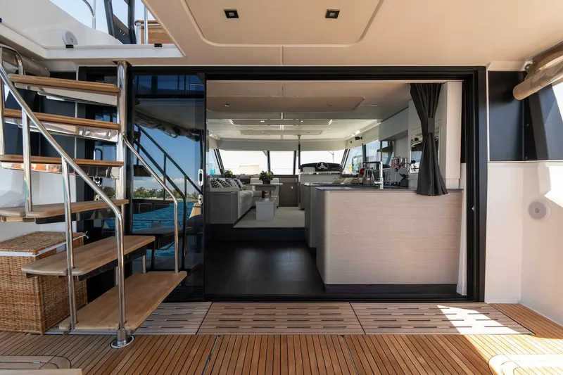  Yacht Photos Pics Luxury interior of 2022 Fountaine Pajot MY6 yacht with modern design and wooden flooring.