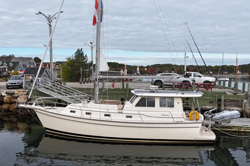  Yacht Photos Pics 2008 Island Packet SP Cruiser docked at a marina with scenic background.