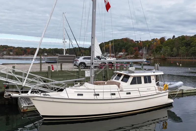  Yacht Photos Pics 2008 Island Packet SP Cruiser docked at a marina with scenic background.