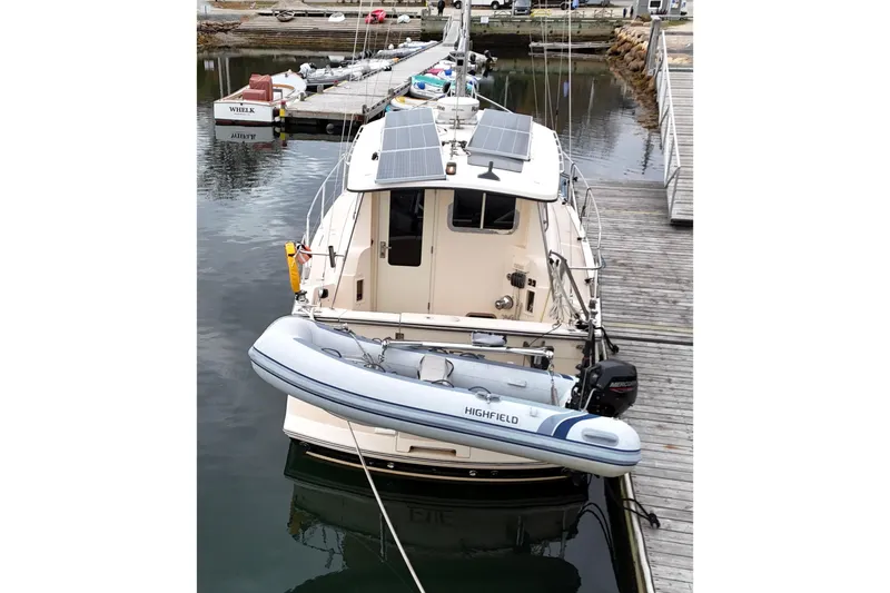  Yacht Photos Pics 2008 Island Packet SP Cruiser docked with solar panels and inflatable boat.