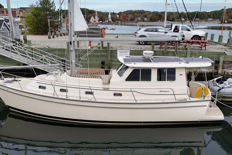  Yacht Photos Pics 2008 Island Packet SP Cruiser docked at a marina with scenic background.