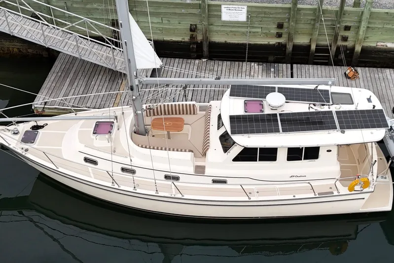  Yacht Photos Pics 2008 Island Packet SP Cruiser docked, featuring solar panels and spacious deck.