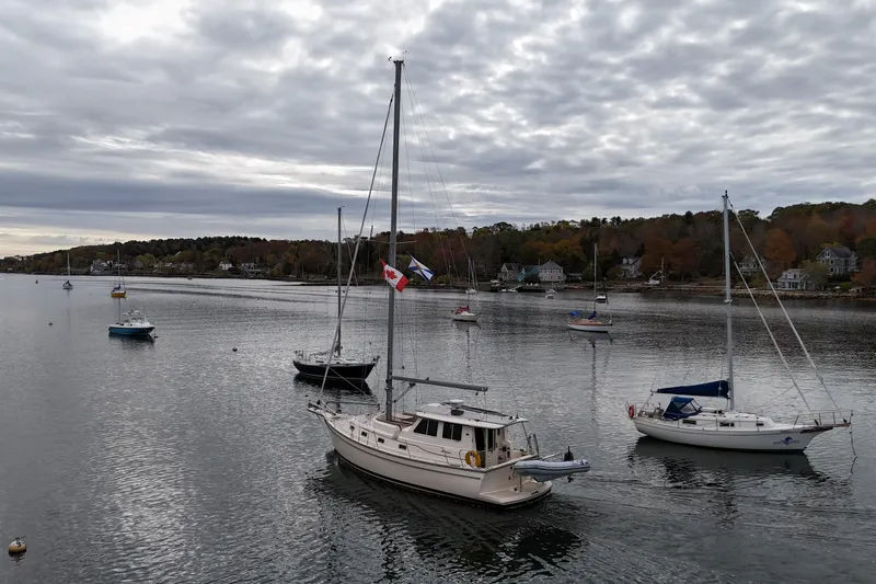  Yacht Photos Pics Sailboats anchored in a calm harbor, featuring a 2008 Island Packet SP Cruiser.