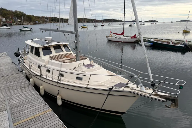  Yacht Photos Pics 2008 Island Packet SP Cruiser docked in a serene marina setting.