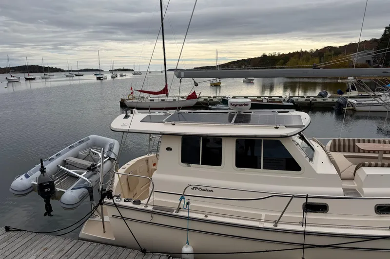  Yacht Photos Pics 2008 Island Packet SP Cruiser docked at a serene marina with sailboats.