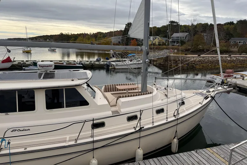  Yacht Photos Pics 2008 Island Packet SP Cruiser docked at a marina, featuring solar panels and a scenic waterfront.
