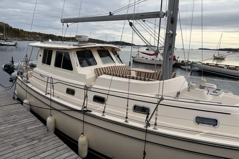  Yacht Photos Pics 2008 Island Packet SP Cruiser docked at a marina under cloudy skies.