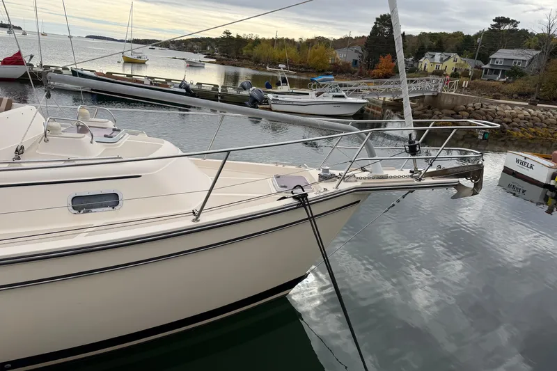  Yacht Photos Pics 2008 Island Packet SP Cruiser docked in a serene marina setting.