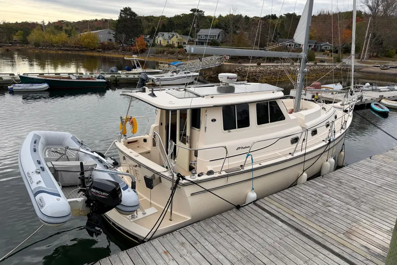  Yacht Photos Pics 2008 Island Packet SP Cruiser docked with inflatable dinghy attached.