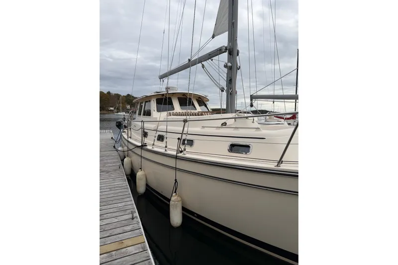  Yacht Photos Pics 2008 Island Packet SP Cruiser docked at marina under cloudy sky.