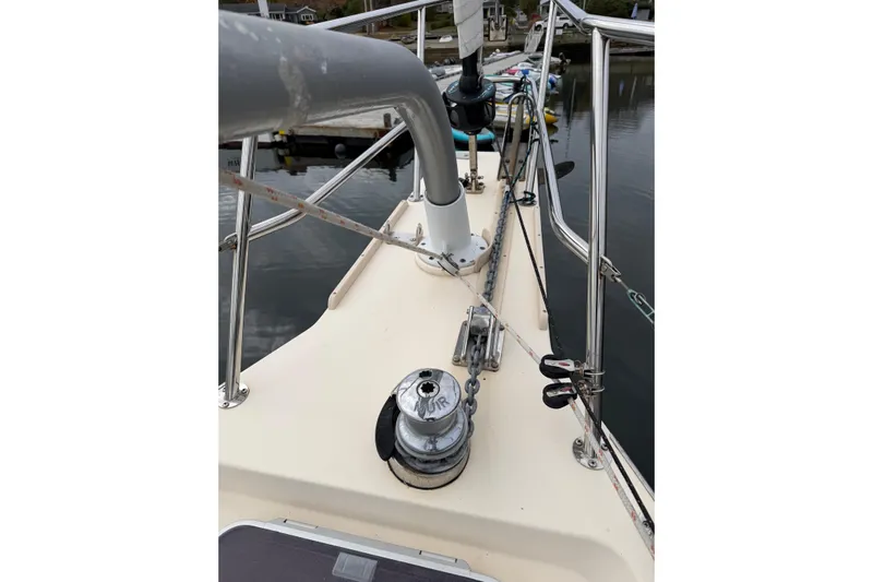  Yacht Photos Pics 2008 Island Packet SP Cruiser deck with winch and railing, docked by the water.