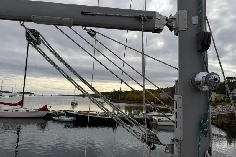  Yacht Photos Pics 2008 Island Packet SP Cruiser sailboat rigging with scenic harbor view in the background.
