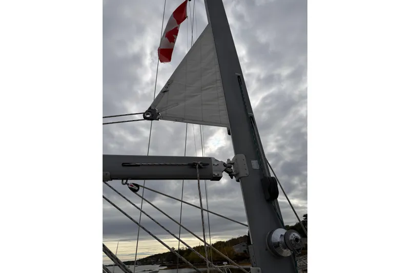  Yacht Photos Pics Sailboat mast and rigging of 2008 Island Packet SP Cruiser under cloudy sky.