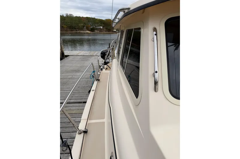  Yacht Photos Pics 2008 Island Packet SP Cruiser docked, showcasing side deck and windows.