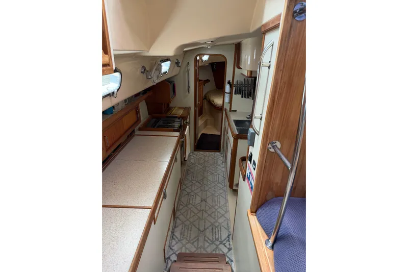  Yacht Photos Pics 2008 Island Packet SP Cruiser interior with kitchen and cozy cabin layout.