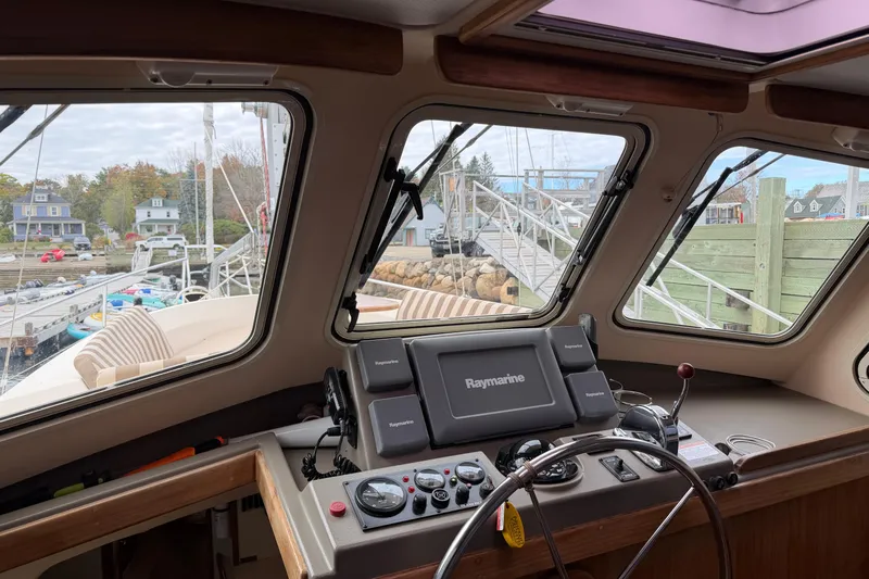  Yacht Photos Pics 2008 Island Packet SP Cruiser helm with Raymarine navigation, docked at a marina.