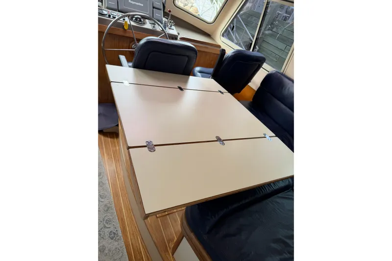  Yacht Photos Pics 2008 Island Packet SP Cruiser interior with foldable table and seating.
