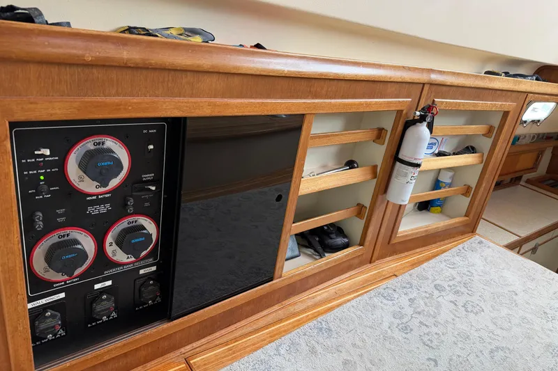  Yacht Photos Pics 2008 Island Packet SP Cruiser interior with control panel and storage shelves.