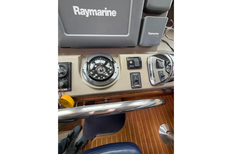  Yacht Photos Pics 2008 Island Packet SP Cruiser helm with Raymarine navigation equipment and compass.