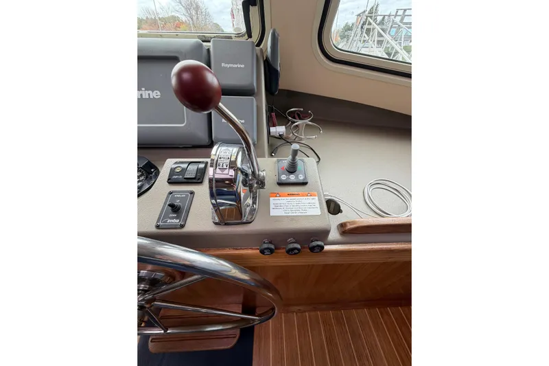  Yacht Photos Pics 2008 Island Packet SP Cruiser helm with controls and navigation equipment.