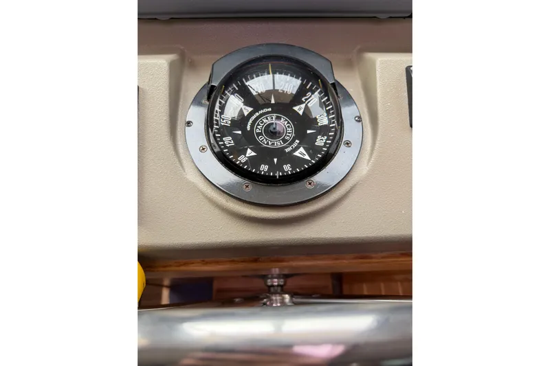  Yacht Photos Pics Compass on 2008 Island Packet SP Cruiser dashboard, displaying cardinal directions.