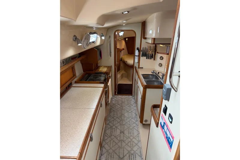  Yacht Photos Pics 2008 Island Packet SP Cruiser interior with kitchen and cozy cabin view.