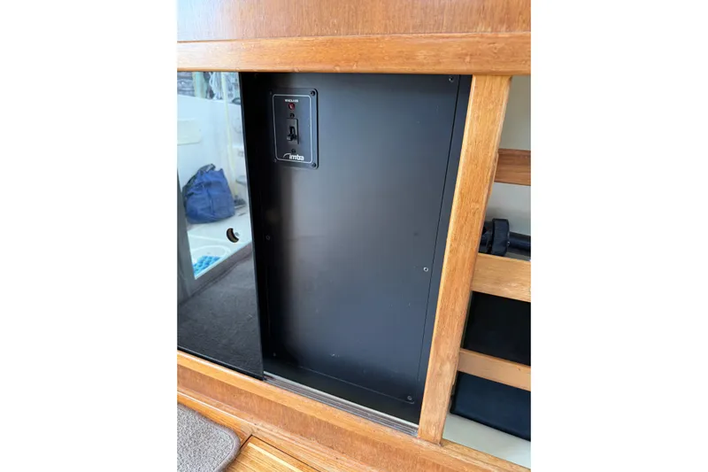  Yacht Photos Pics 2008 Island Packet SP Cruiser interior with electrical panel and wooden finish.