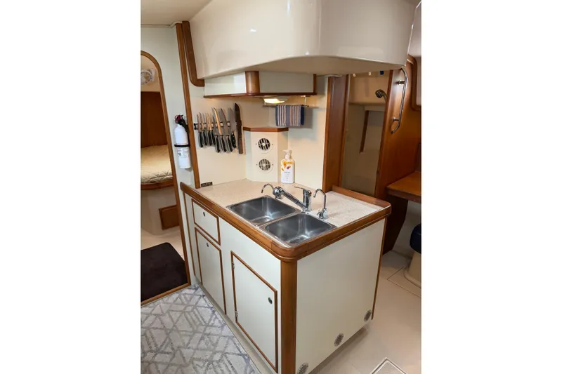  Yacht Photos Pics 2008 Island Packet SP Cruiser galley with sink, knife rack, and storage cabinets.