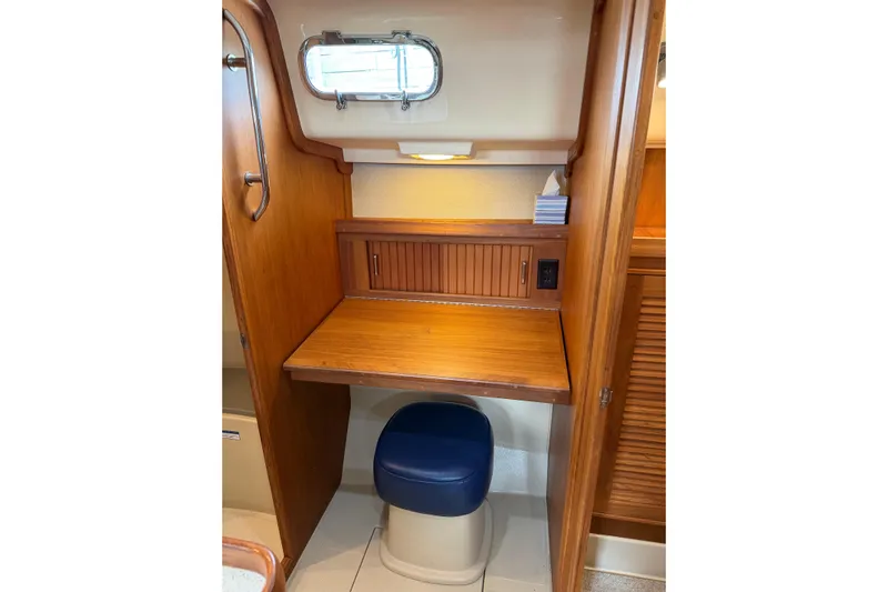  Yacht Photos Pics 2008 Island Packet SP Cruiser interior with wooden desk and blue stool.