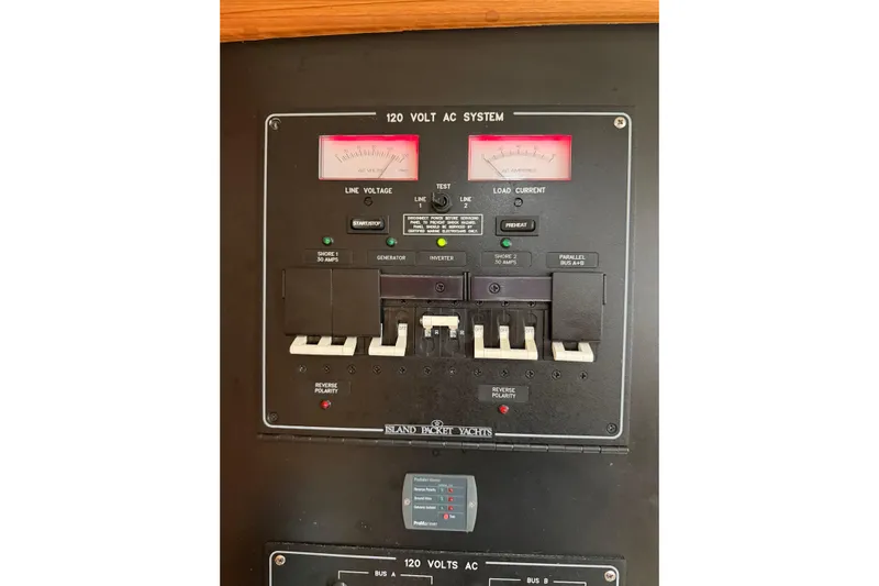  Yacht Photos Pics Electrical panel of a 2008 Island Packet SP Cruiser yacht, showing 120-volt AC system controls.